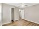 Bedroom with hardwood floors, a closet, and an entry door at 7625 E 35Th St, Indianapolis, IN 46226