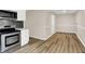 Modern kitchen with stainless steel appliances and stylish backsplash at 7625 E 35Th St, Indianapolis, IN 46226