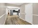 Open-concept view from entryway into a stylish kitchen with stainless appliances at 7625 E 35Th St, Indianapolis, IN 46226