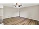 Spacious living room featuring wood-look floors and a ceiling fan at 7625 E 35Th St, Indianapolis, IN 46226