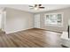 Bright living room with a large window and wood-look flooring at 7625 E 35Th St, Indianapolis, IN 46226