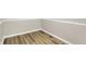 Corner of a room highlighting the flooring and base trim details at 7625 E 35Th St, Indianapolis, IN 46226