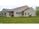 Spacious backyard featuring sliding door to backyard, grill, and ample sunlight and green grass at 808 Heartland Ln, Brownsburg, IN 46112