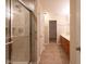 Bathroom featuring a glass-enclosed shower and storage at 808 Heartland Ln, Brownsburg, IN 46112
