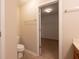 Half bath with neutral paint and access to walk-in closet at 808 Heartland Ln, Brownsburg, IN 46112