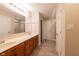 Bathroom featuring double sinks, vanity, and neutral tiled floor at 808 Heartland Ln, Brownsburg, IN 46112