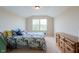 Bedroom with a large window, dresser and bed that make this room a peaceful retreat at 808 Heartland Ln, Brownsburg, IN 46112
