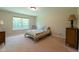 Cozy bedroom with a full sized bed, carpet floors and ample natural light at 808 Heartland Ln, Brownsburg, IN 46112