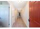 Inviting hallway with neutral walls, tiled floor, and classic lighting fixtures at 808 Heartland Ln, Brownsburg, IN 46112
