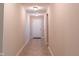 Neutral hallway with tiled floors and white door with access to the outside at 808 Heartland Ln, Brownsburg, IN 46112