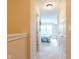 Hallway has carpet, doors and lighting that highlights a pathway to an inviting bedroom at 808 Heartland Ln, Brownsburg, IN 46112