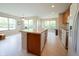 Bright kitchen with a large island, perfect for entertaining, illuminated by natural light through big windows at 808 Heartland Ln, Brownsburg, IN 46112