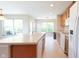 Bright kitchen with a large island, perfect for entertaining, illuminated by natural light through big windows at 808 Heartland Ln, Brownsburg, IN 46112