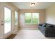 Bright sunroom with big windows and a comfortable couch, perfect for relaxation or enjoying outdoor views at 808 Heartland Ln, Brownsburg, IN 46112