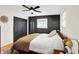 Bedroom with dark sliding doors, a comfortable bed, and an eye-catching area rug at 820 S Eaglewood Dr, Zionsville, IN 46077