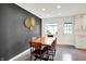 Elegant dining room with a wooden table, modern decor, and ample seating space at 820 S Eaglewood Dr, Zionsville, IN 46077
