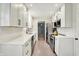 Modern kitchen featuring white cabinets, stainless steel appliances, and a clean, updated design at 820 S Eaglewood Dr, Zionsville, IN 46077