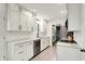 Bright kitchen with white cabinets, stainless steel appliances, light-colored countertops, and an open layout at 820 S Eaglewood Dr, Zionsville, IN 46077