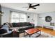 Cozy living room featuring a comfortable couch, hardwood floors, and ample natural light at 820 S Eaglewood Dr, Zionsville, IN 46077