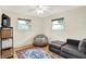 Cozy living room with a comfortable sofa, a beanbag chair, and two bright windows at 820 S Eaglewood Dr, Zionsville, IN 46077