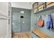 Stylish mudroom with built-in storage, bench, and hooks for organization and convenience at 820 S Eaglewood Dr, Zionsville, IN 46077