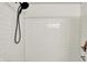 Tiled shower with modern fixtures, including a shower head and built-in corner shelf at 820 S Eaglewood Dr, Zionsville, IN 46077