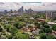 Aerial view of property in urban neighborhood surrounded by mature trees and nearby city skyline at 847 N Park Ave, Indianapolis, IN 46202