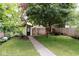 Gravel pathway leads to a charming outbuilding in the backyard at 847 N Park Ave, Indianapolis, IN 46202
