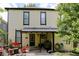 Backyard view with mature trees, covered patio, and seating area at 847 N Park Ave, Indianapolis, IN 46202