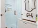 Stylish bathroom featuring white subway tile, bronze hardware, and a glass shower enclosure at 847 N Park Ave, Indianapolis, IN 46202