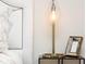 Bedroom nightstand with a lamp, artwork, and decor at 847 N Park Ave, Indianapolis, IN 46202