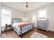 Charming bedroom with hardwood floors, neutral walls, and two windows at 847 N Park Ave, Indianapolis, IN 46202