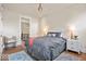 Bedroom with a ceiling fan, an open doorway to the hall, and hardwood floors at 847 N Park Ave, Indianapolis, IN 46202