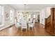 Bright dining room featuring hardwood floors, modern chandelier, and staircase at 847 N Park Ave, Indianapolis, IN 46202