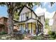 Charming two-story home boasts a welcoming front porch and beautifully maintained landscaping at 847 N Park Ave, Indianapolis, IN 46202