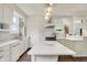 Bright, modern kitchen with white cabinetry, a kitchen island, and updated appliances at 847 N Park Ave, Indianapolis, IN 46202