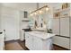 Kitchen featuring a white island, stainless steel appliances, modern lighting, and an open layout at 847 N Park Ave, Indianapolis, IN 46202