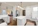 Open-concept kitchen with a center island, modern lighting, and stainless steel appliances at 847 N Park Ave, Indianapolis, IN 46202