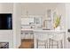 Contemporary kitchen with white cabinets, sleek countertops, and bar stool seating at 847 N Park Ave, Indianapolis, IN 46202
