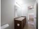 Bathroom with large mirror, granite vanity, and doorway, offering both functionality and ample space at 895 Geronimo Dr, Greenfield, IN 46140