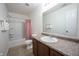 Bathroom featuring a shower/tub combo, pink curtain, toilet and vanity with a granite countertop at 895 Geronimo Dr, Greenfield, IN 46140