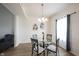 Bright dining area features a glass table and seating for four near a window at 895 Geronimo Dr, Greenfield, IN 46140