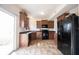 Spacious kitchen has stainless steel appliances, ample cabinet space, and tile floor at 895 Geronimo Dr, Greenfield, IN 46140