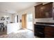 Kitchen with views to dining area and out sliding glass doors, dark countertops at 895 Geronimo Dr, Greenfield, IN 46140