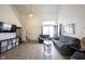 Well-lit living room showcases the staircase and a view of the dining area at 895 Geronimo Dr, Greenfield, IN 46140