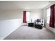 Upstairs sitting area with carpeted floors and plenty of natural light at 895 Geronimo Dr, Greenfield, IN 46140