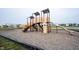 A colorful community playground featuring slides, climbing structures, and swings for residents at 895 Geronimo Dr, Greenfield, IN 46140