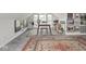 Attic room with a desk and artwork featuring boho rug and light gray carpet at 914 N College Ave, Indianapolis, IN 46202