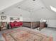 Attic Bonus Room features comfortable seating area with art collection and boho rug at 914 N College Ave, Indianapolis, IN 46202