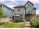 Backyard with a wooden deck, outdoor seating, and a well-maintained lawn at 914 N College Ave, Indianapolis, IN 46202